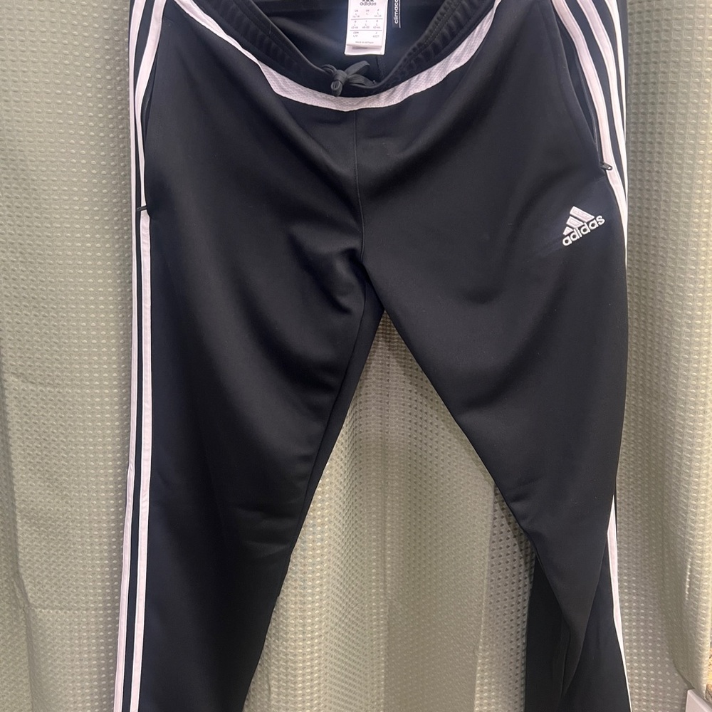 Women’s black and white stripe adidas sweatpants. Never worn adidas pants sz L